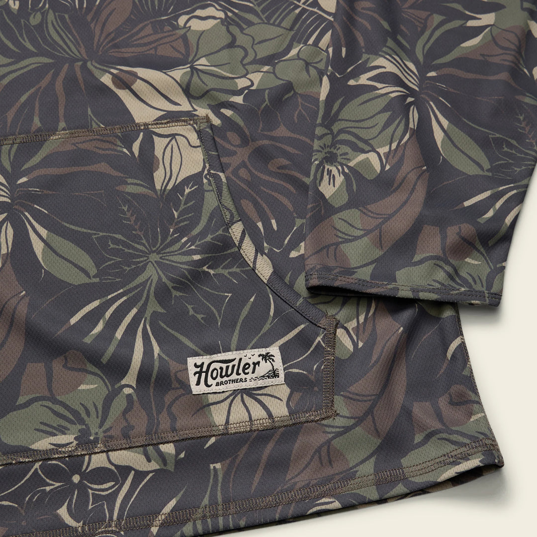 Camouflage-patterned fabric with 'Howler' brand logo on a white background