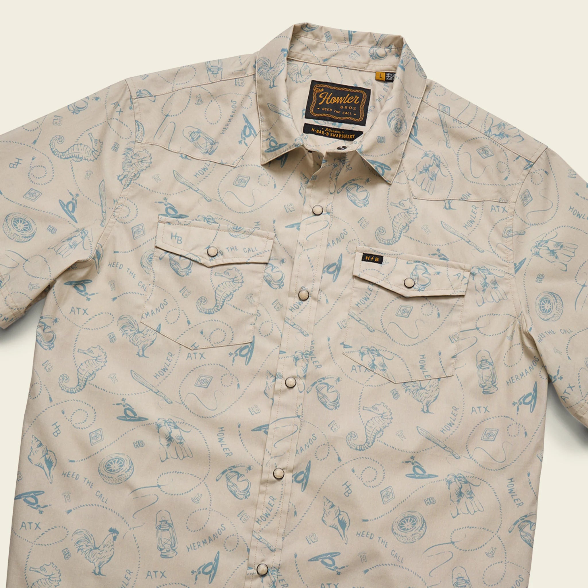 Beige shirt with blue graphic patterns on a white background