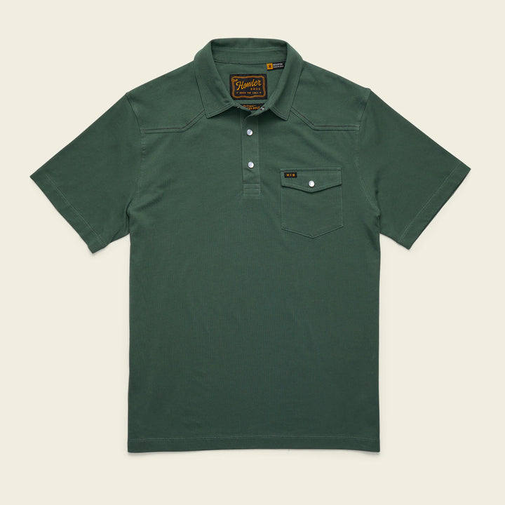 Green polo shirt with a brand label on a beige background