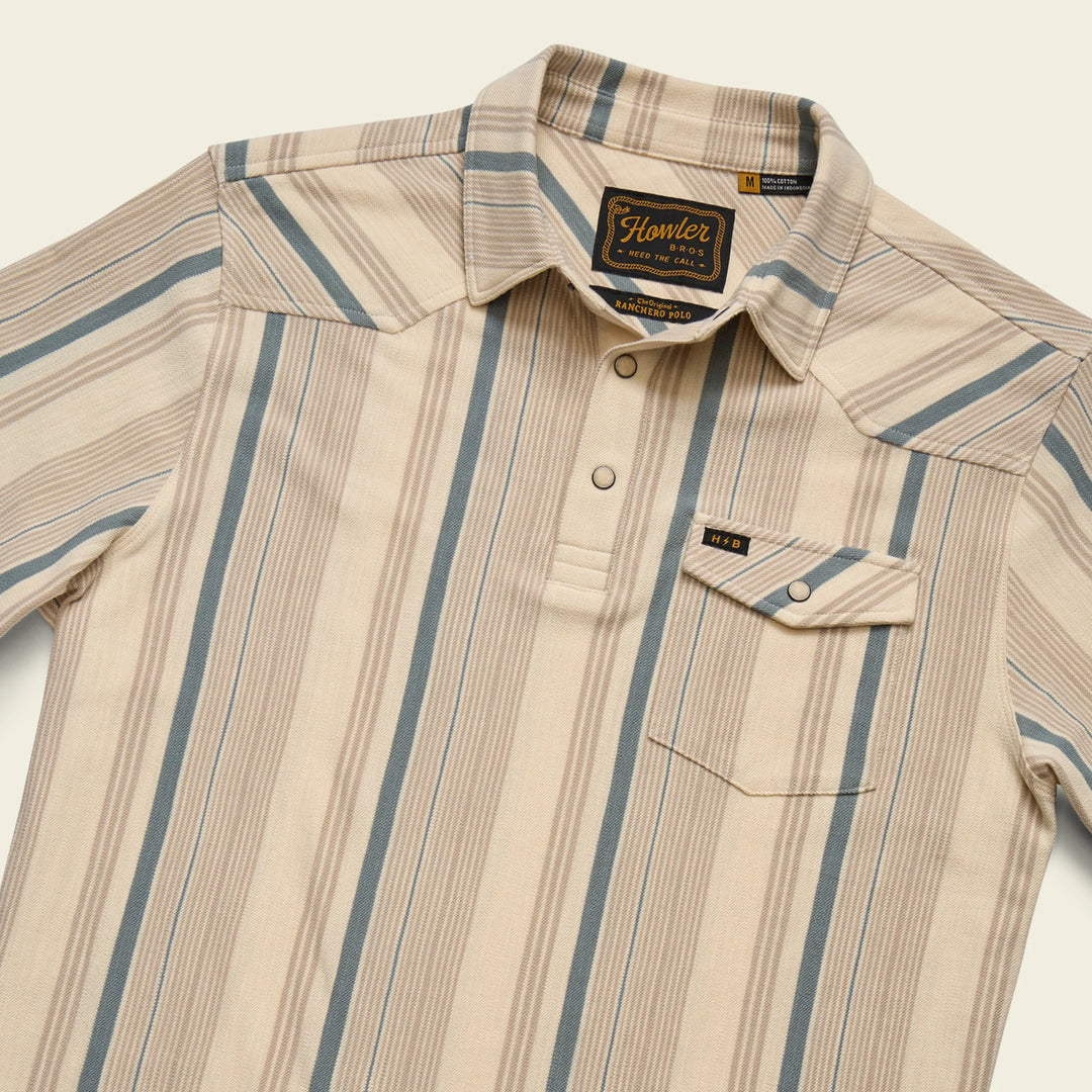 Beige and blue striped shirt with 'Howler' brand label on a beige background