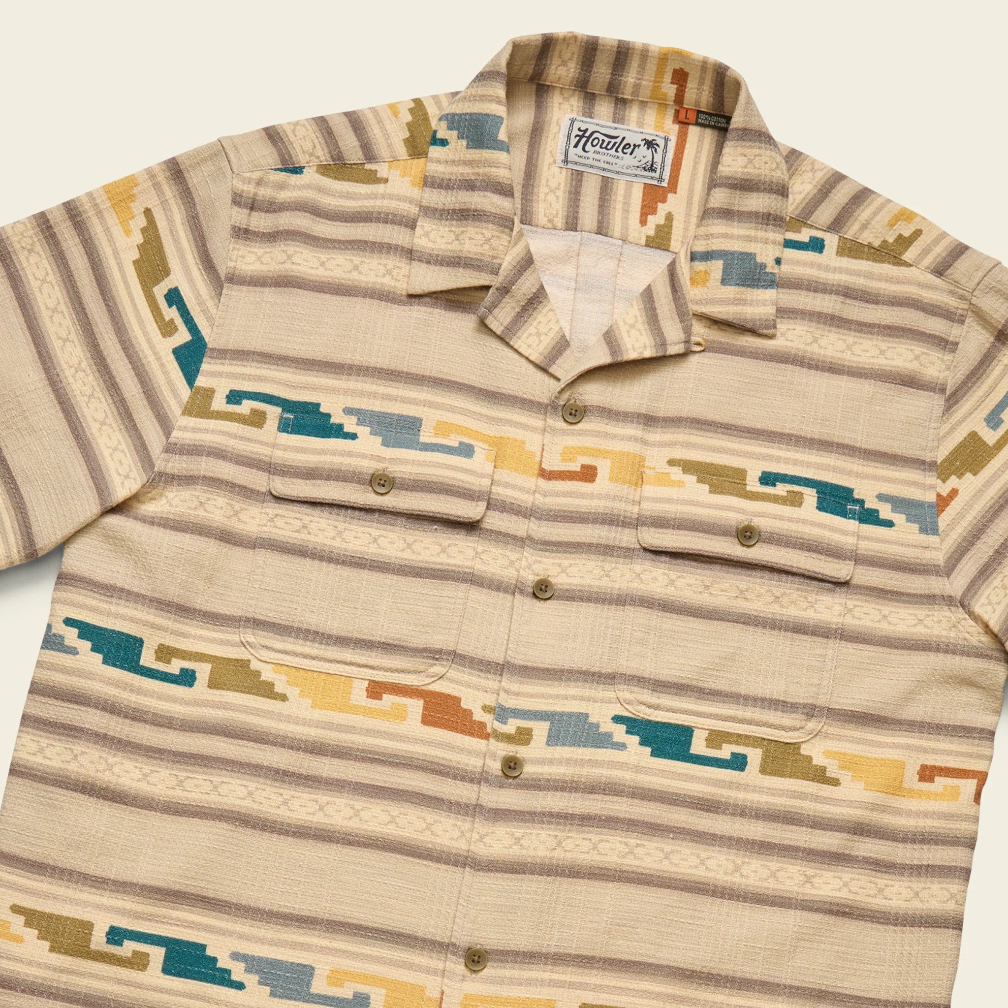 Beige patterned shirt with button details on a light background