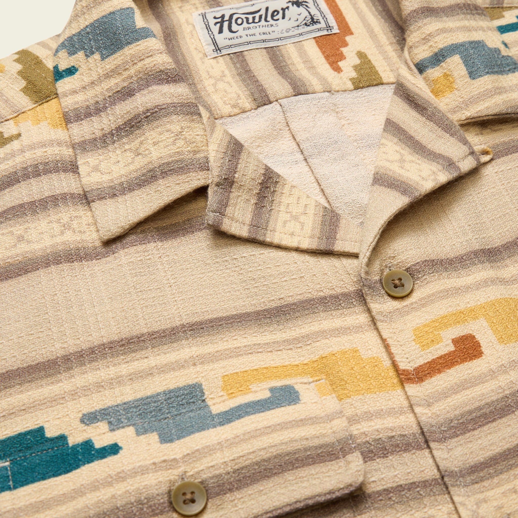 Close-up of a patterned shirt with a Howler brand label.