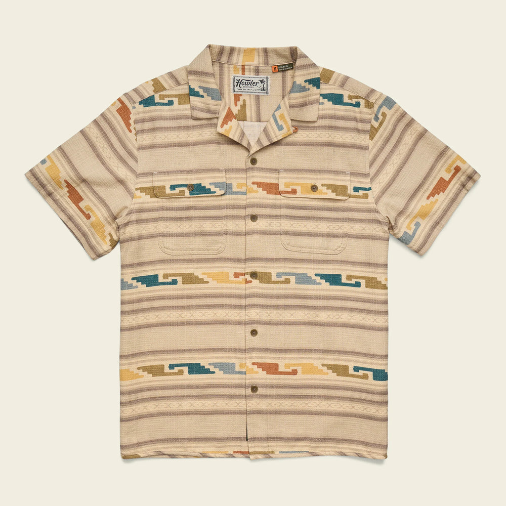 Beige patterned shirt with a brand logo on a light beige background