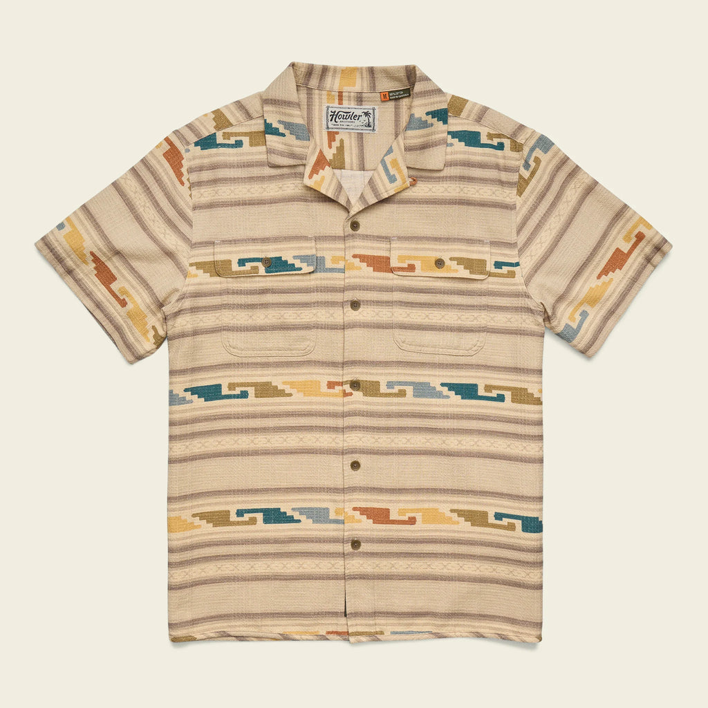Beige patterned shirt with a brand logo on a light beige background