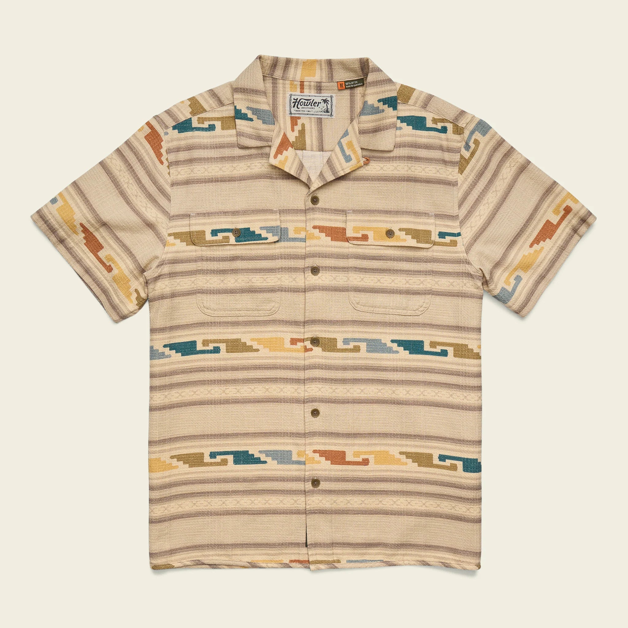 Beige patterned shirt with a brand logo on a light beige background
