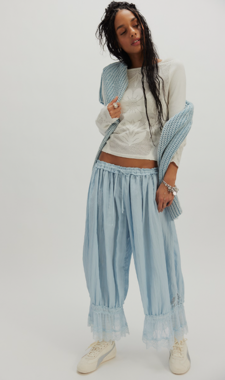 Delilah Long Sleeve Top in Clean Ivory on model paired with light blue pants and sweater