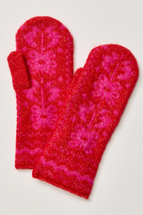 A pair of fuzzy knit winter mittens in a vibrant red and hot pink floral pattern, displayed on a light gray background.