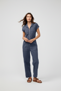 Woman wearing a blue boiler suit 
