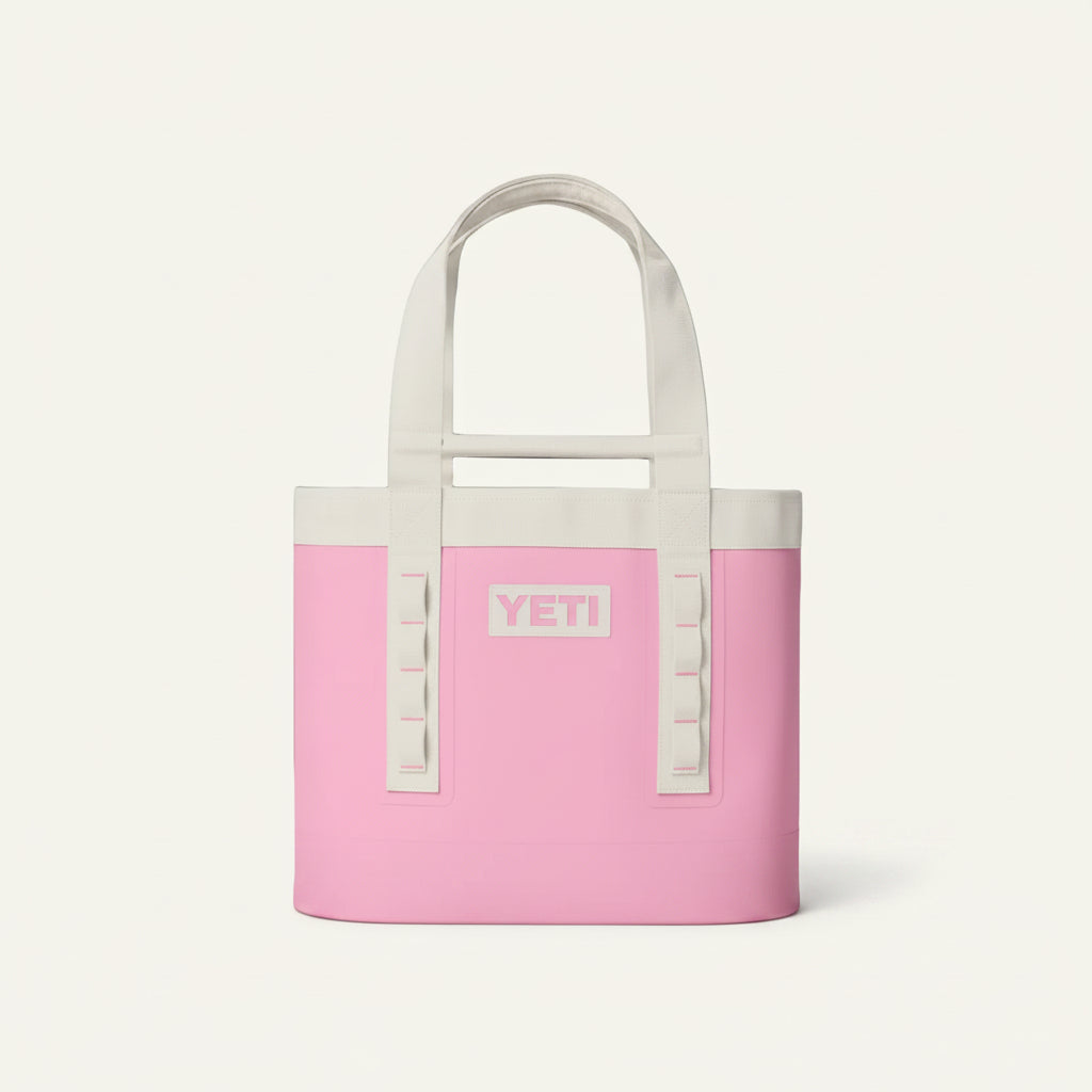 Pink YETI cooler bag with white handles on a transparent background