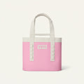 Pink YETI cooler bag with white handles on a transparent background