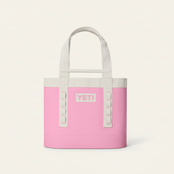 Pink YETI cooler bag with white handles on a transparent background