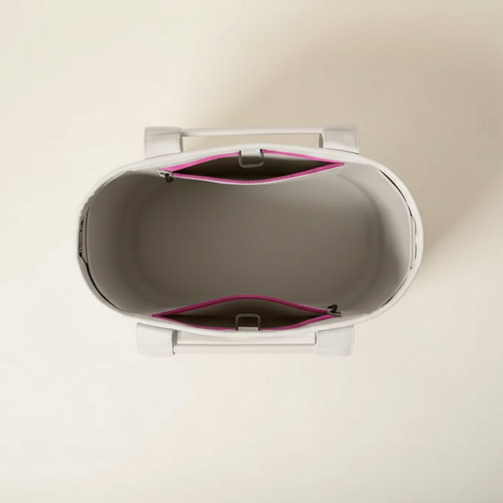 Gray and pink electronic device on a white background