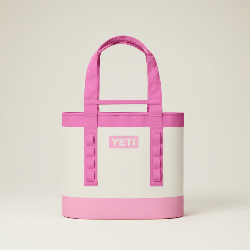 Pink and white YETI tote bag on a black background