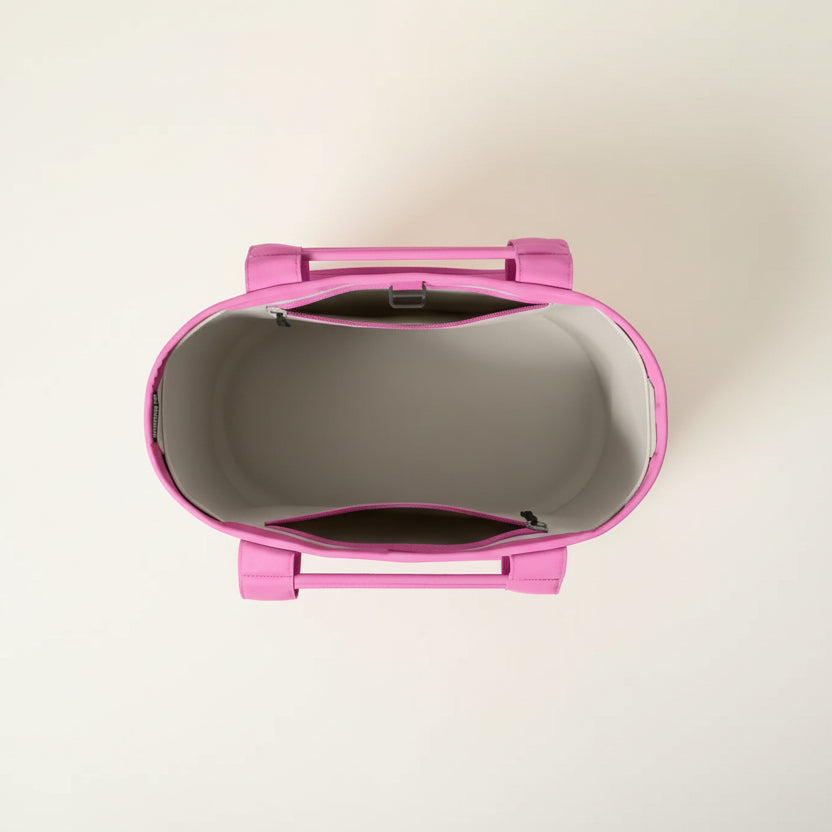 Pink and gray product on a black background