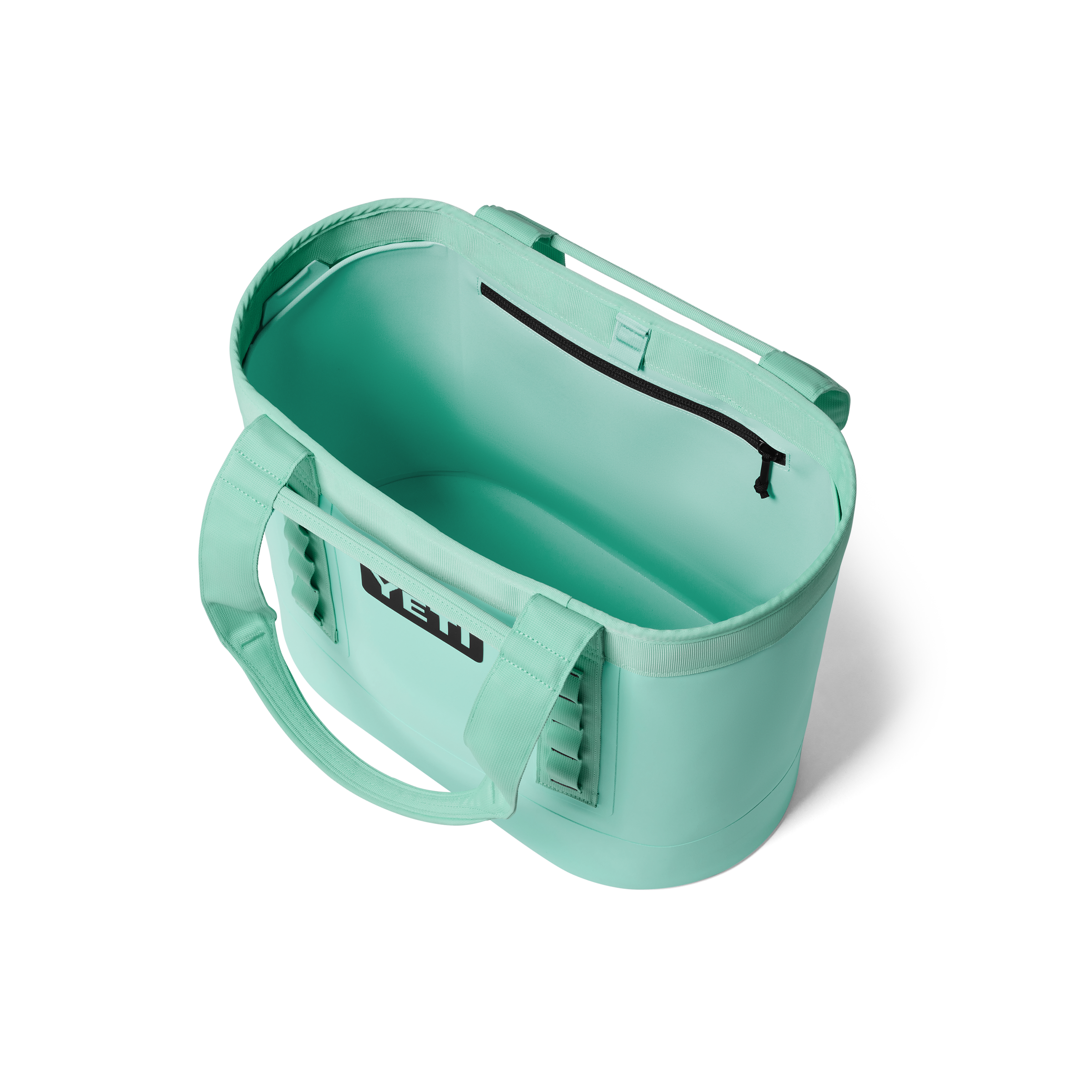 Mint green container with a handle on a white background