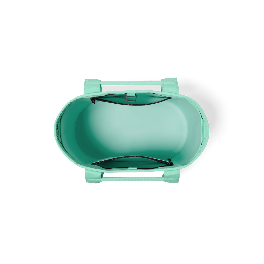 Turquoise portable grill on a white background