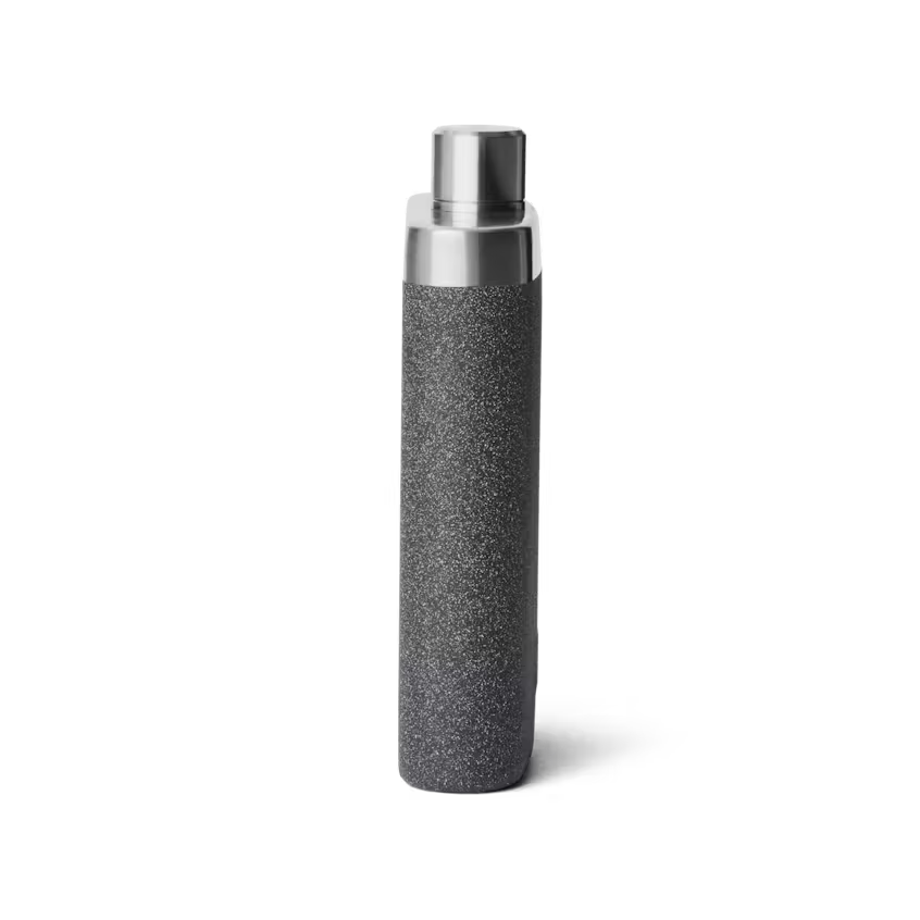 Black textured bottle with silver cap on a white background
