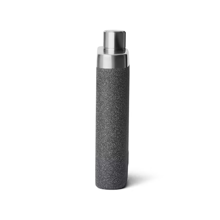 Black textured bottle with silver cap on a white background