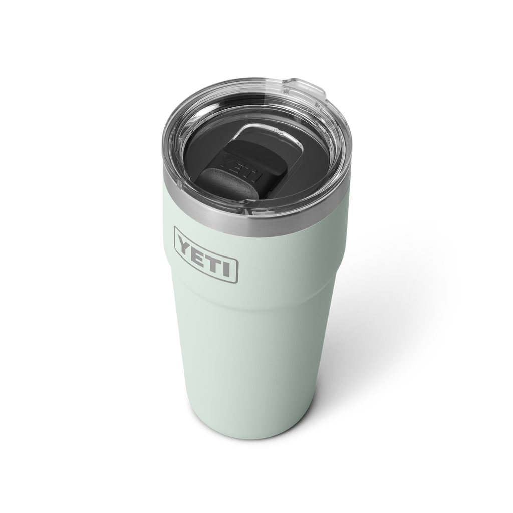 Light blue YETI tumbler with a clear lid on a white background