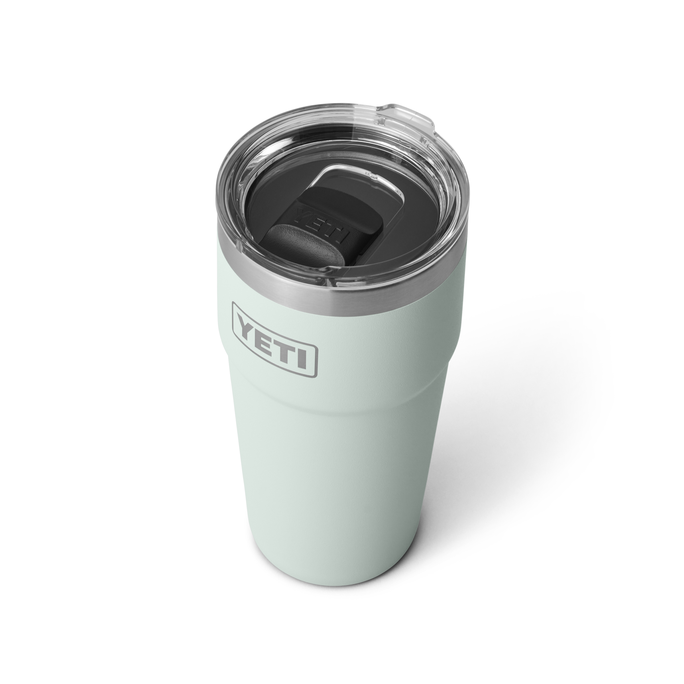 Light blue YETI tumbler with a clear lid on a white background
