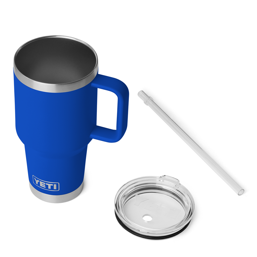 Blue YETI mug with handle, straw, and lid on a white background