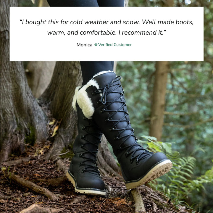 Black winter boots with white fur lining worn in a forest setting, featuring a customer review above.