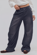 Woman wearing black wide leg pants brown shoes and long sleeve white T-sirt