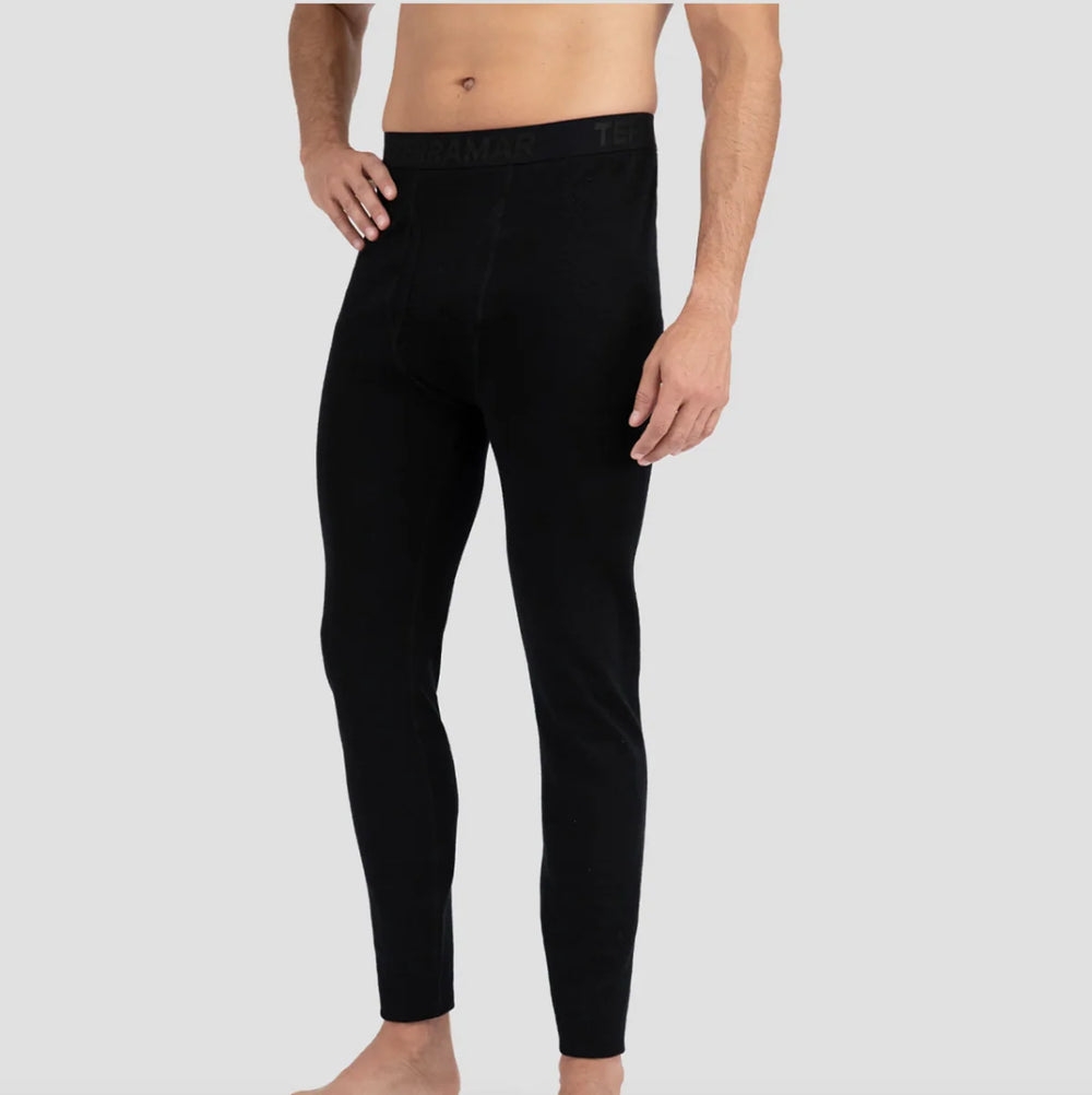 Black men's leggings worn by a person on a gray background