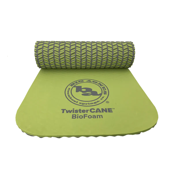 Green foam roller and mat with 'Big Agnes' branding on a white background