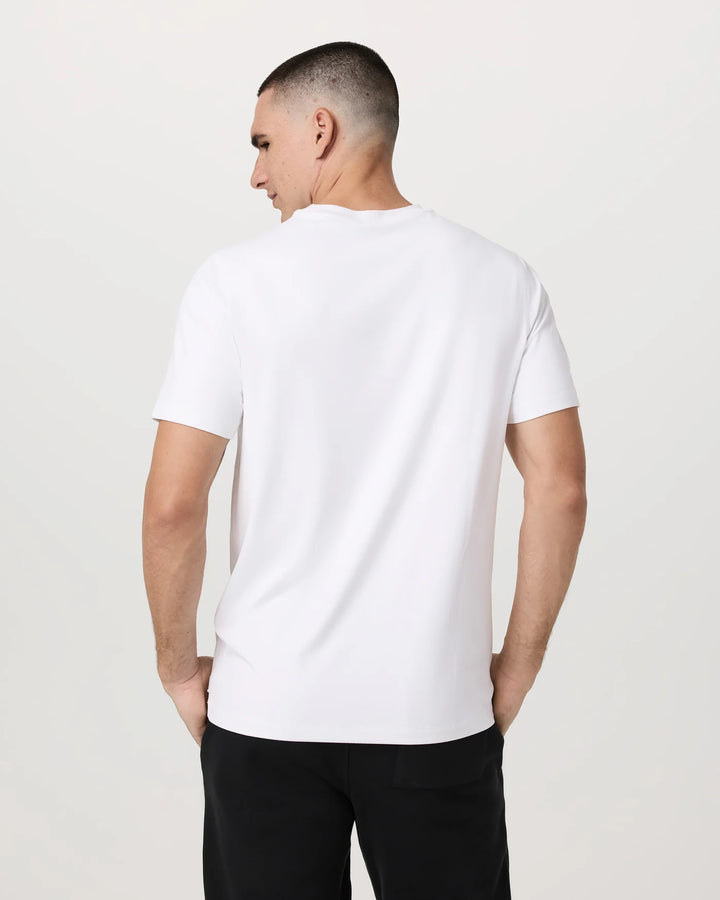 Man wearing a white t-shirt against a plain background