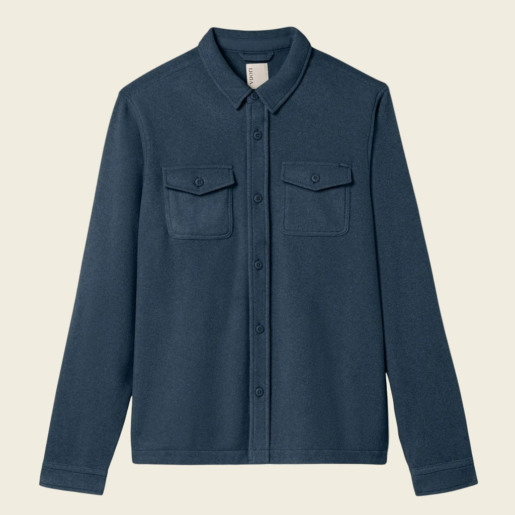 Blue shirt with two chest pockets on a white background