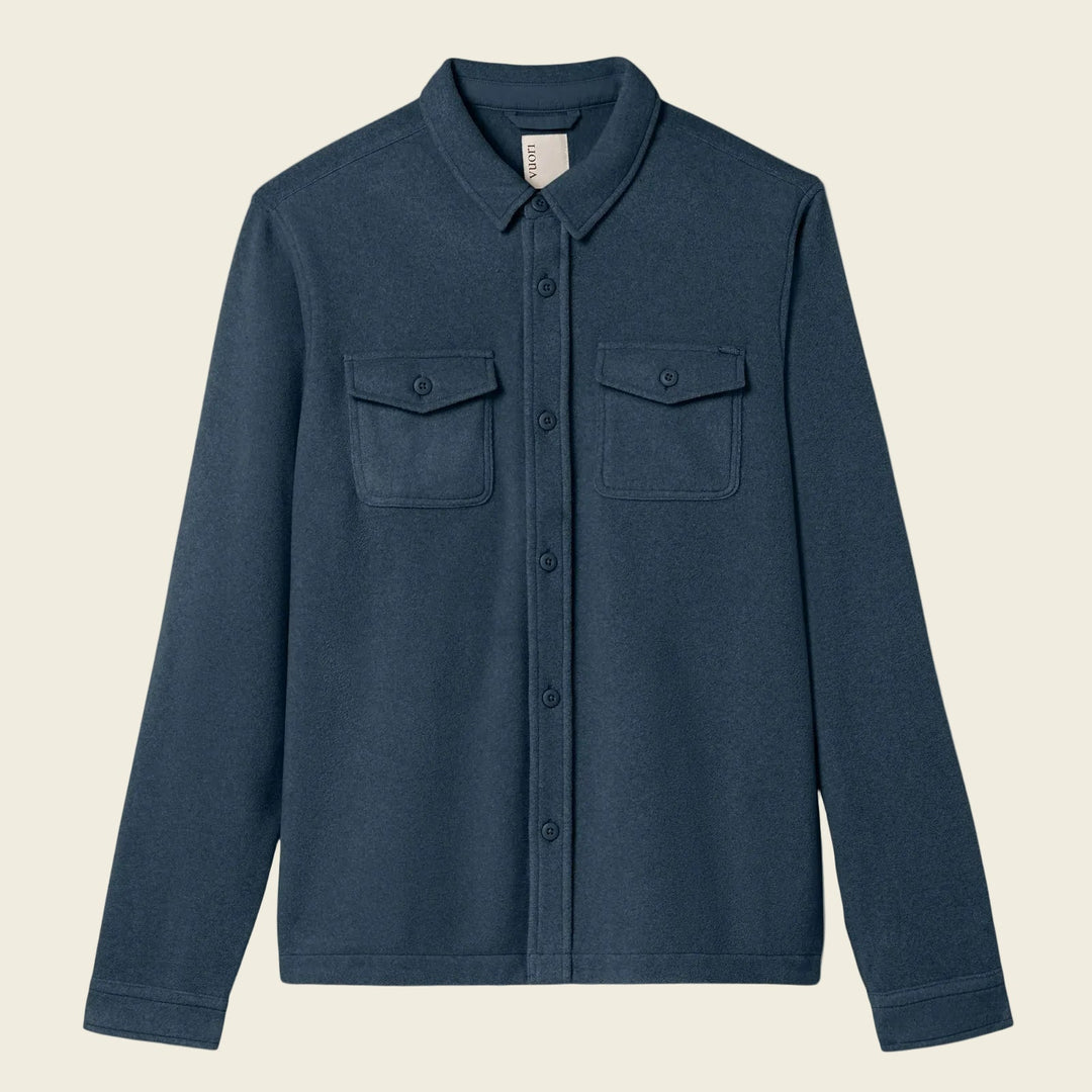 Blue shirt with two chest pockets on a white background