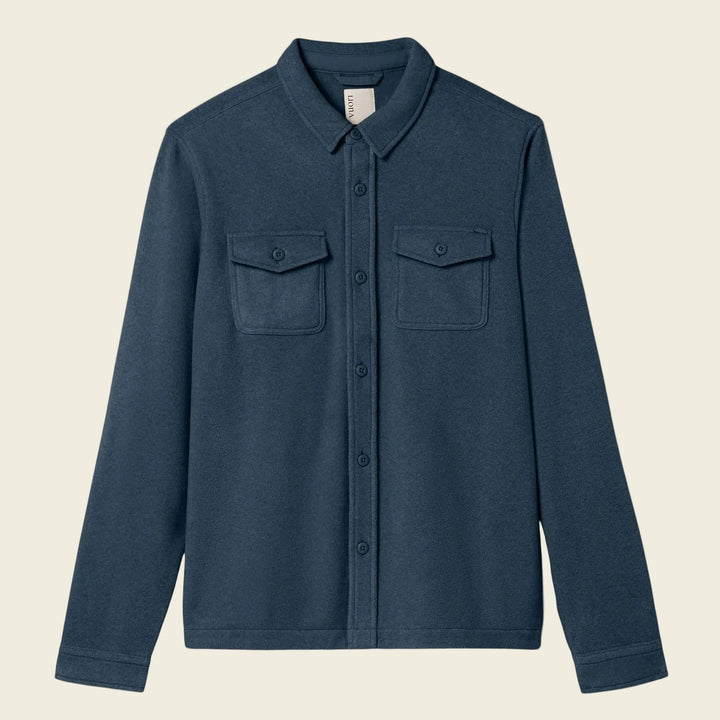 Blue shirt with two chest pockets on a white background