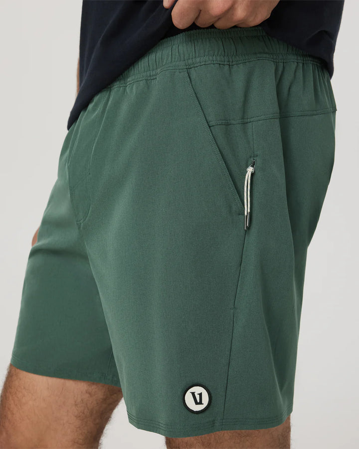 Green shorts with a logo on a plain background