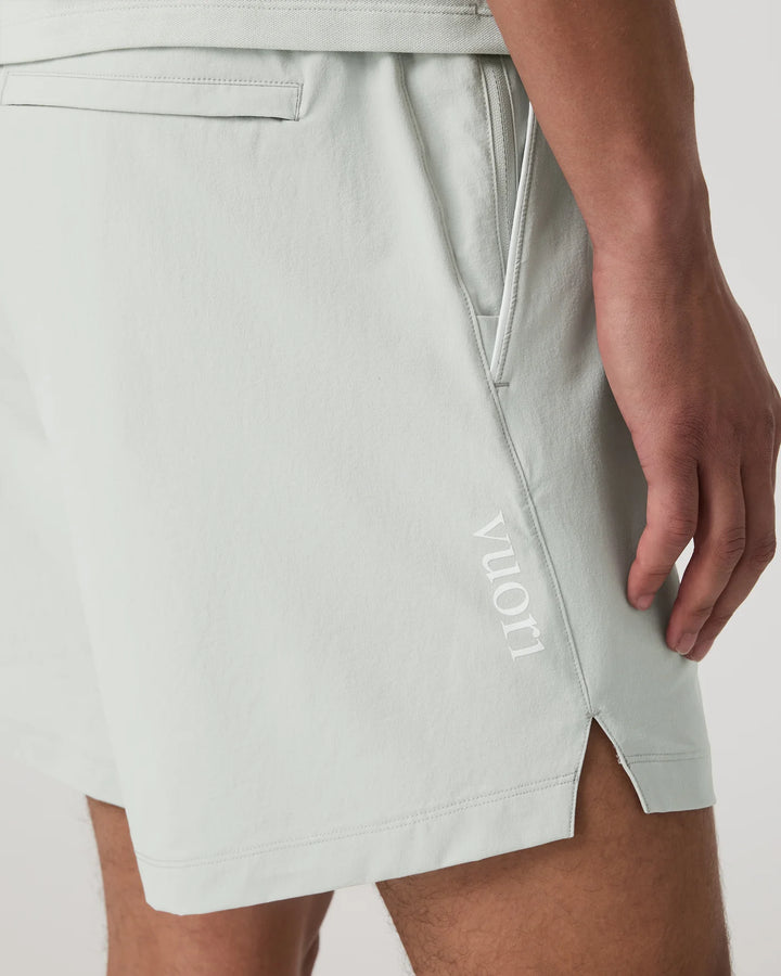 Light gray shorts with a brand logo on a neutral background