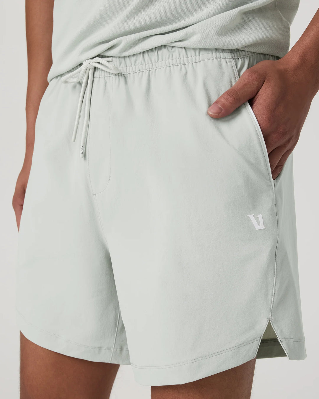 Light gray shorts with a small logo on a plain background