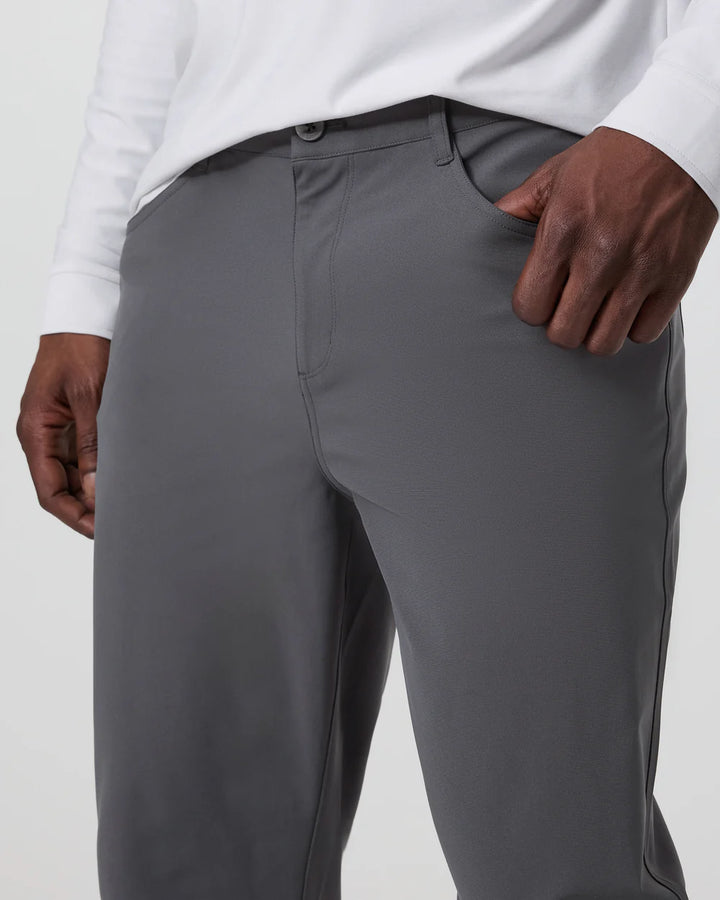 Gray pants worn by a person on a light gray background