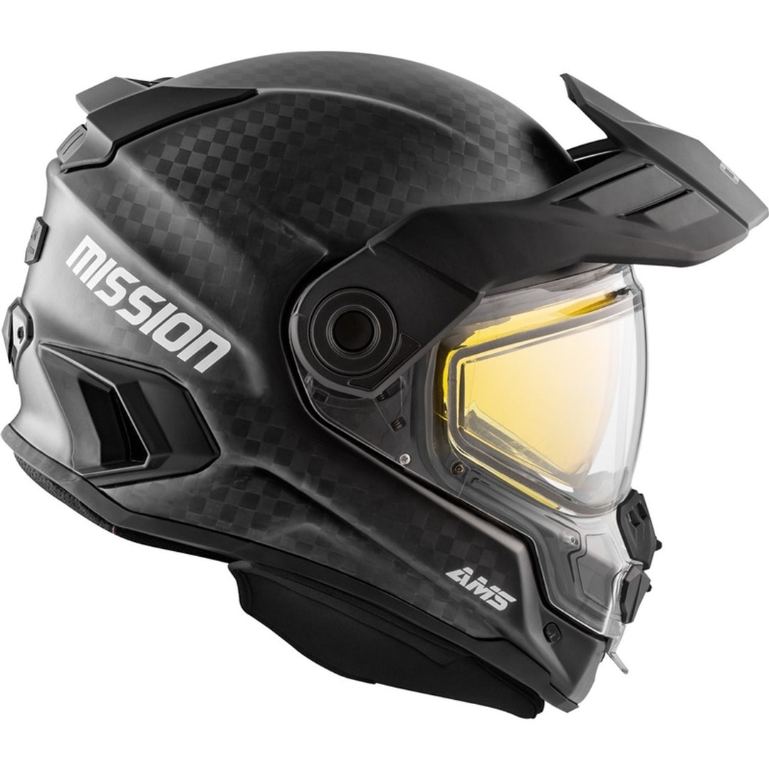 Black snowmobile helmet with yellow visor and 'Mission' branding on a white background