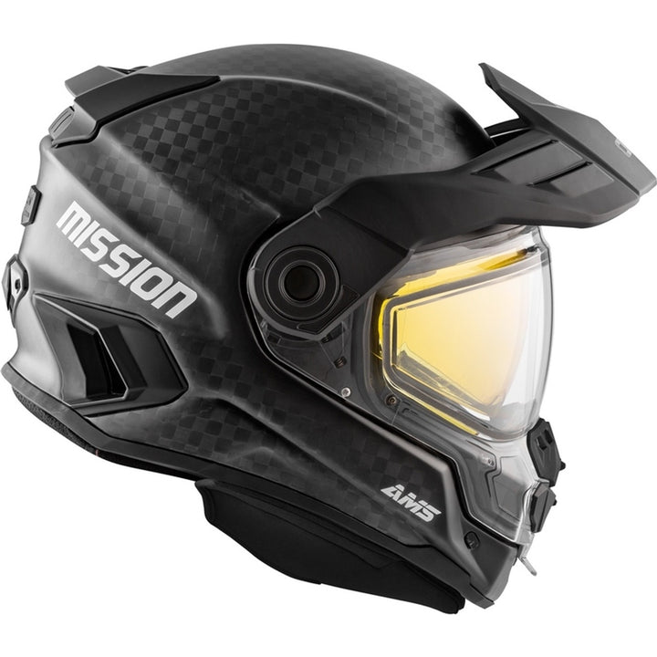 Black snowmobile helmet with yellow visor and 'Mission' branding on a white background