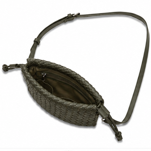 An olive green woven leather belt bag with a long adjustable strap, shown from a top-down view on a white background.