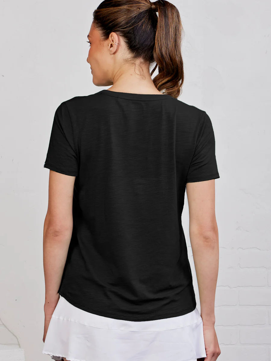 Person wearing a black t-shirt with a plain background