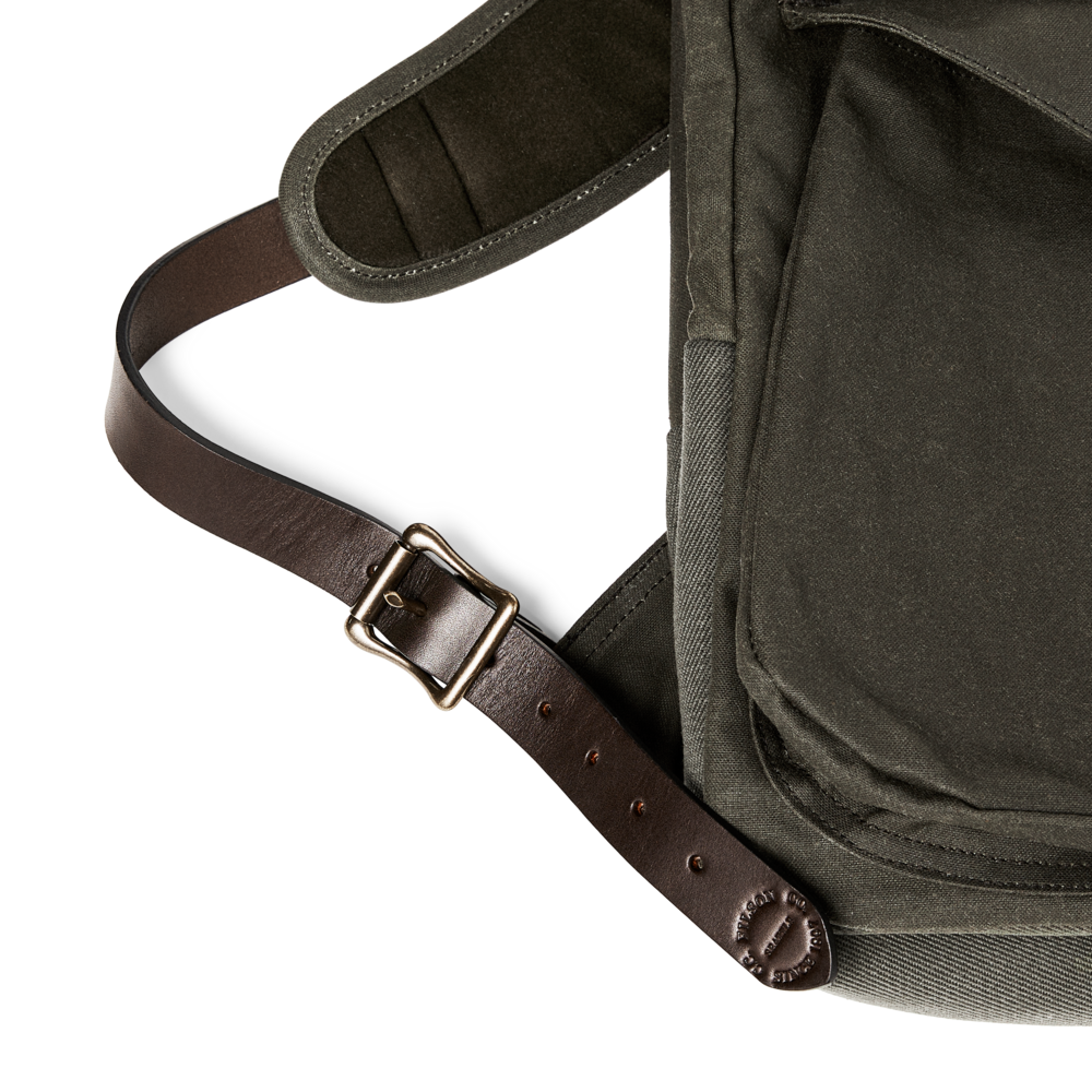 Close-up of a dark olive green bag with a brown adjustable strap and metal buckle, shown against a plain white background.