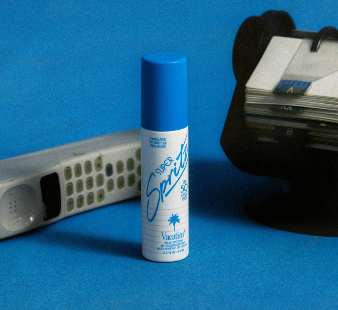 Super Spritz bottle with blue cap on a blue background