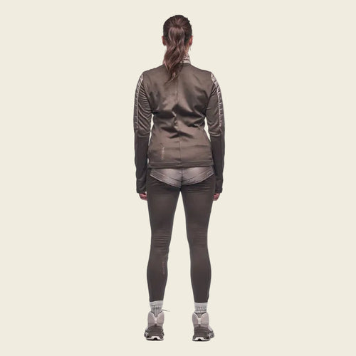 Person wearing a gray athletic outfit on a white background