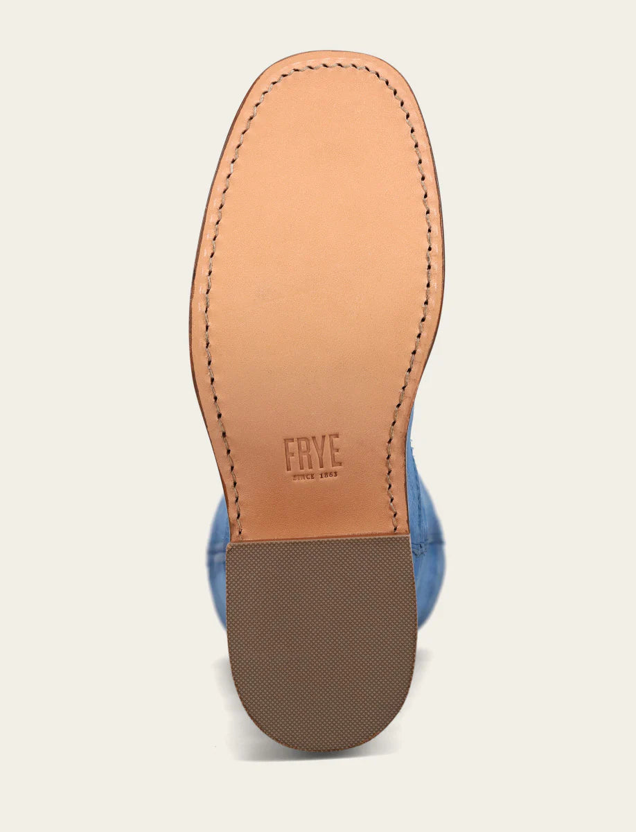 Close-up of a shoe sole with 'Frye' branding on a light background