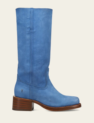 Blue knee-high boot with a brown sole on a light gray background