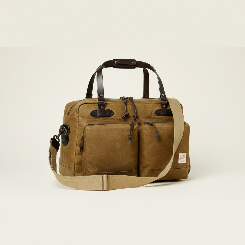 Brown duffel bag with leather straps on a white background