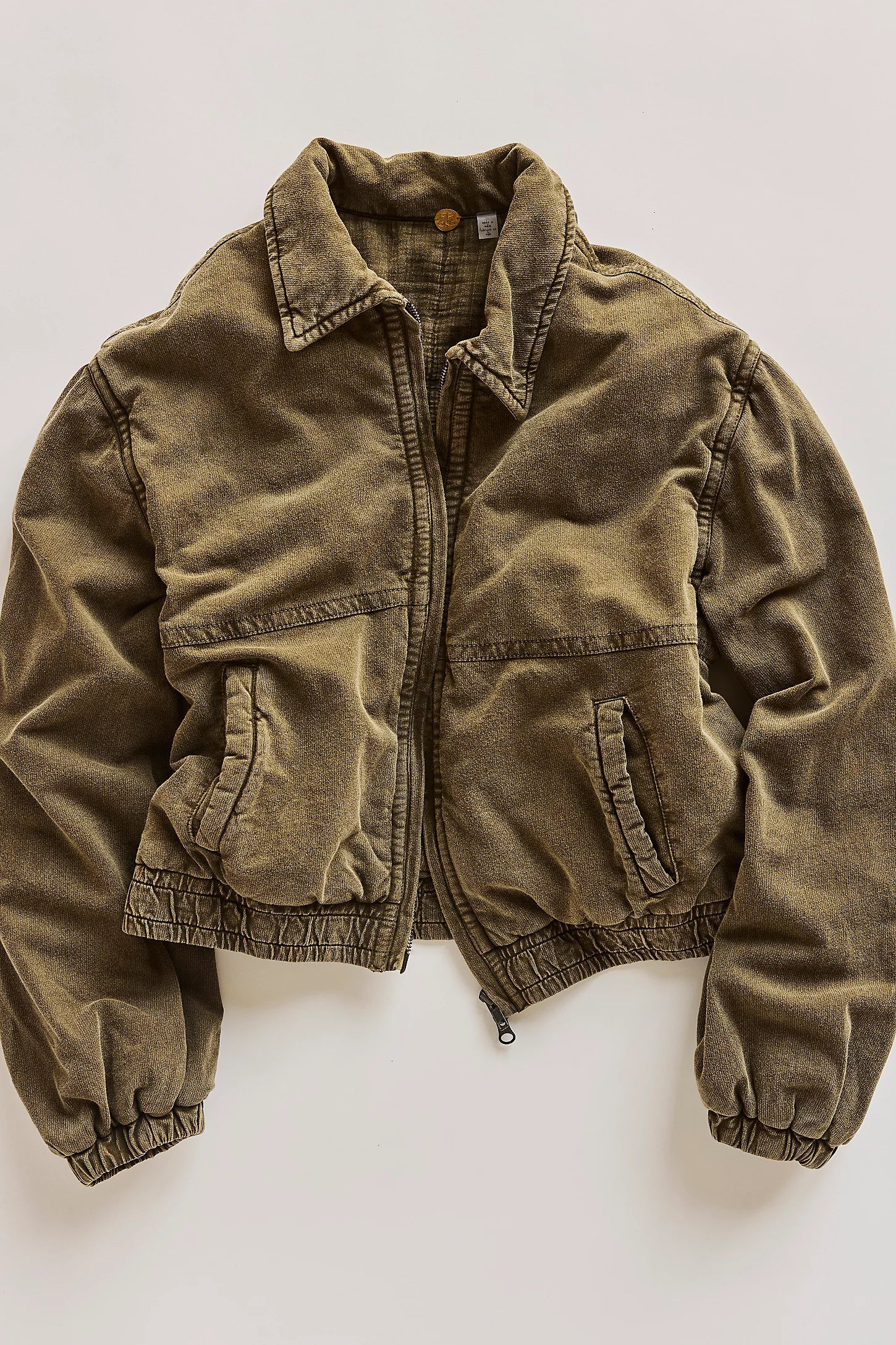 A green jacket on a white background