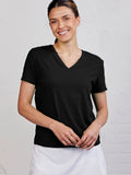Woman wearing a black V-neck t-shirt against a white background