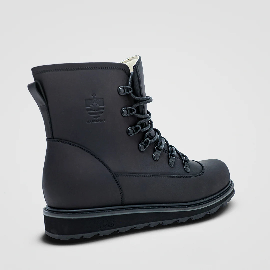 Black boot with brand logo on a light gray background